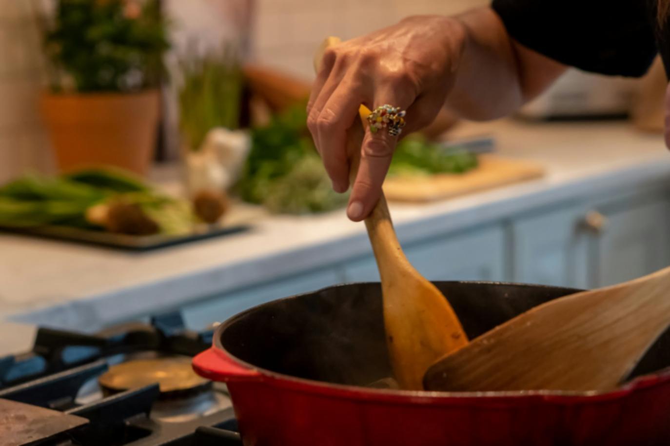 Students practicing healthy cooking techniques in a learning environment